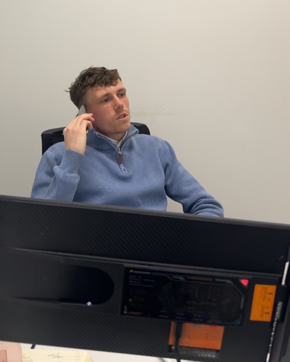 Charlie Everest speaking with a property owner on the phone